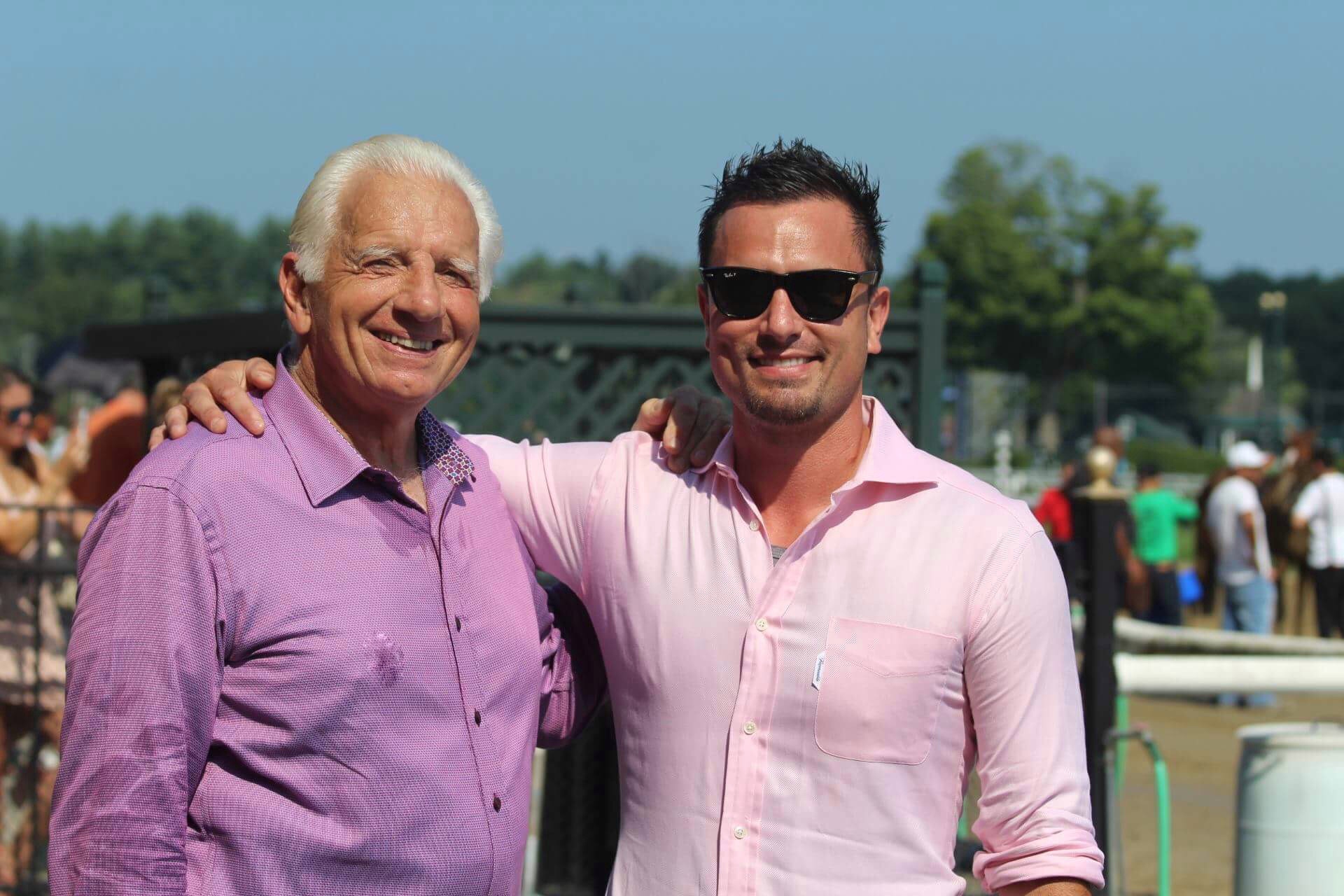 Jerry Bilinski and Kenny Toye standing shoulder to shoulder at the track on a summer afternoon